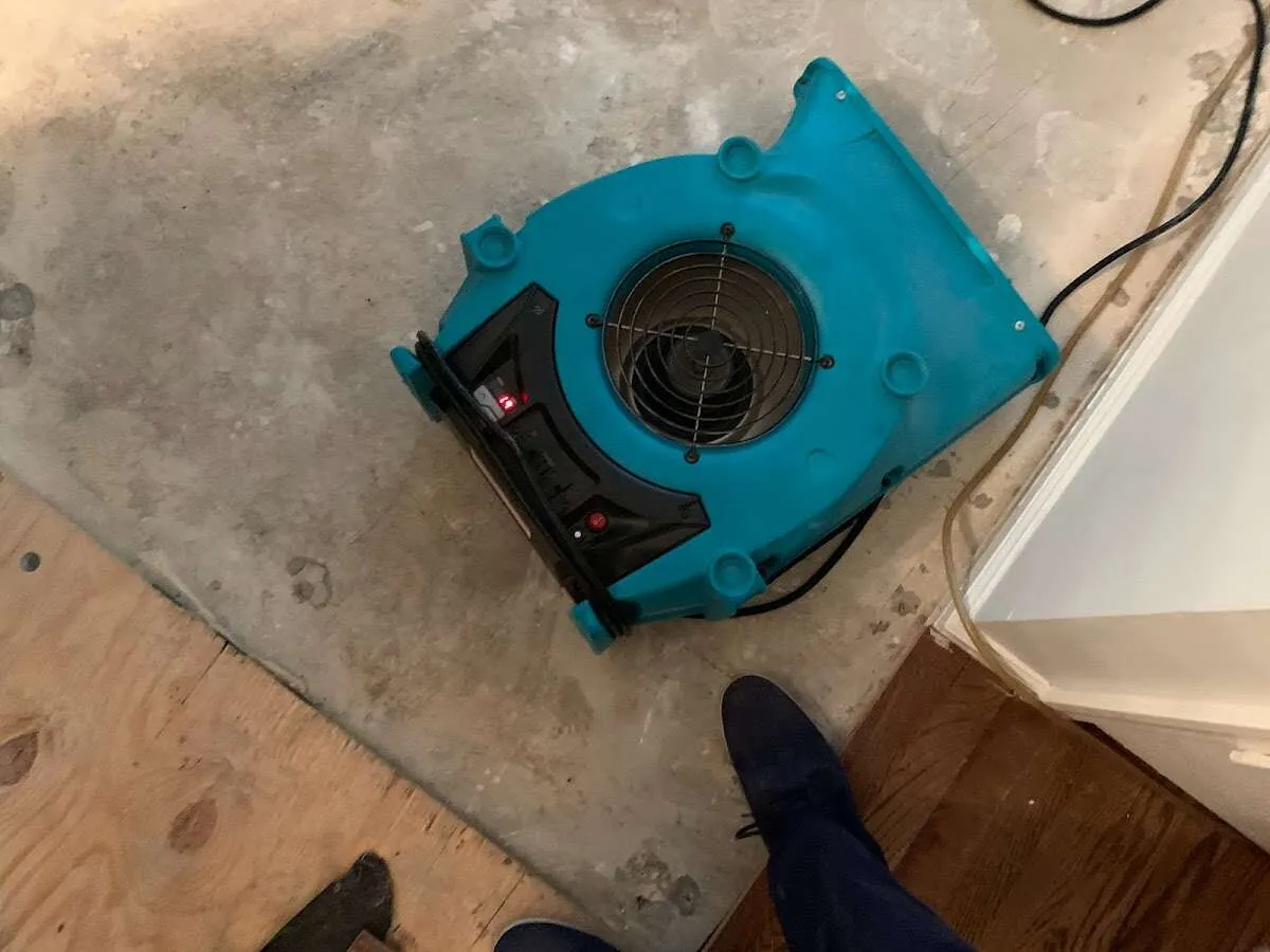 Air mover drying subfloor during Leak Detection & Repair in Cimarron Hills
